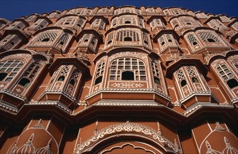INDIA, Rajasthan, Jaipur , Hawa Mahal or Palace of the Winds. View looking up at the pink facade of