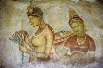 SRI LANKA, Sigiriya, Rock painting of two women in cave on the side of the Hindu hill temple fort