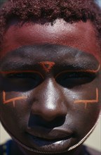KENYA, North Frontier, Maralal, Portrait of Samburu moran with traditional face paint