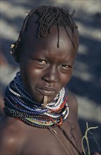KENYA, North Frontier, Loyengalani , Portrait of El Molo girl wearing traditional jewellery