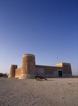 QATAR, Zubara, "Exterior view of a fort with crenellated towers, built in 1938 and used as a police