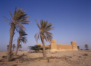 QATAR, Zubara, "Exterior view of a fort with crenellated towers, built in 1938 and used as a police