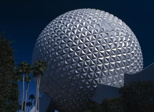 USA, Florida , Orlando , Walt Disney Epcot Centre. Spaceship Earth surrounded by Palm Trees