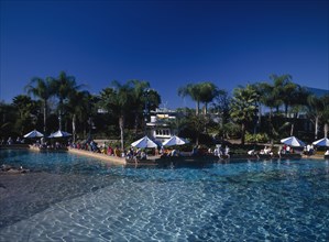 USA, Florida,  Orlando , Seaworld. View across a pool towards visitors gathered along the edge near