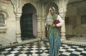 INDIA, Rajasthan , Deshnok, Interior of Karni Mata Temple near Bikaner with woman worshipper in