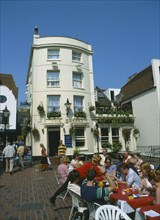 ENGLAND, East Sussex , Brighton, East Street . The Sussex pub exterior with diners seated outside.
