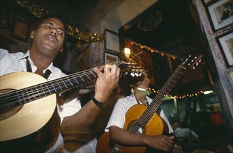 CUBA, Havana , Guitarists playing in La Bodeguita del Medio.