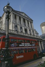 ENGLAND, London, "Bank of England building in Threadneedle street, with red routemaster bus in the