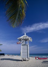 USA, Florida , Fort Lauderdale, Lifeguard hut on sandy beach with American flag flying