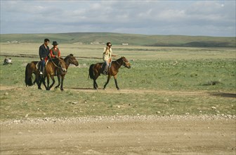 MONGOLIA, Animals, Horses, Mongol Horsemen riding through open land