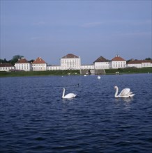 GERMANY, Bavaria, Munich, Schloss Nymphenburg. Viewed from across the canal with swans on water