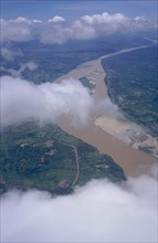 LAOS, Vientiane, Aerial view of the Mekong River through clouds