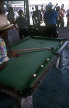 CUBA, Gualmaro  , Men playing Pool while other men look on