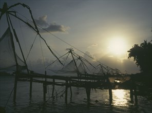 INDIA, Kerala, Cochin, Chinese fishing nets at sunset