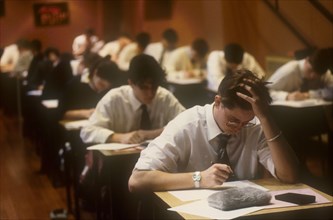 CHILDREN, Education, Examinations, Male teen students taking Advanced level exams