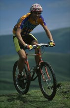 10065617 SPORT Cycling  Mountain Biking Young man on muddy mountain bike in the Lake District.