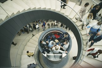 FRANCE, Ille de France, Paris, The Louvre interior. View looking down spiral staircase to central
