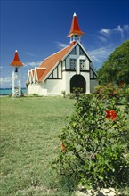 MAURITIUS,  Cap Malheureux, Red and white chapel with garden in front