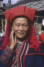 VIETNAM, North, Sapa, Portrait of Zao minority woman with her hand to her face