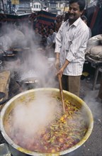 INDIA,  , Delhi, Cooking potato curry in the street.
