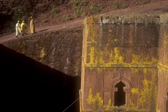 ETHIOPIA, Wolo Province, Lalibela, Bet Giorigos excavated Church of of St George with pilgrims