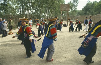 CHINA, Quinghai, Xining , Tuzu Girls Dancing at festival in a village