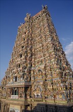 INDIA, Tamil Nadu, Madurai , "Sri Meenakshi Temple, exterior of the West Tower showing elaborate