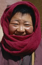 CHINA, Tibet, Tsurpu Monastery , Buddhist Nun wearing a head scarf