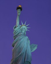 USA, New York State, New York, Angled view looking up at the Statue of Liberty at night