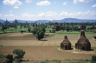 BURMA, Pagan, Two Temples in a field with others seen in the distance