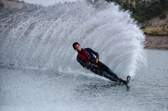 10051455 SPORT Watersports Water Skiing Man on waterski creating wave