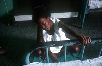 CUBA, Havana, Pregnant woman eduring labour pains in hospital ward