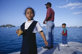 BERMUDA, Mangrove Bay, Father and children standing on wharf.