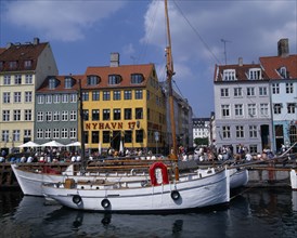 DENMARK, Zealand, Copenhagen, Nyhavn Harbour. Traditional waterfront buildings with groups of