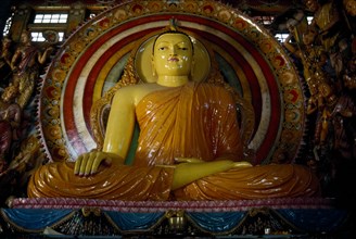 SRI LANKA, Colombo, Seated Buddha statue inside a temple