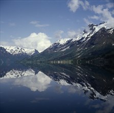 NORWAY, Stryn, "Snow peaked mountains, reflection in water"