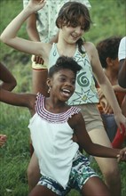 CUBA, Havana Province, Havana, Young black and white girls dancing