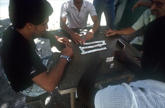 CUBA, Havana, Domino players sitting around the table