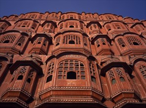 INDIA, Rajasthan  , Jaipur, Palace of the Winds or Hawa Mahal. View Looking up at facade