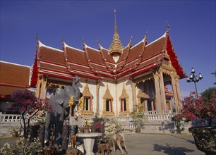 THAILAND, Phuket Island, Wat Chalong, Buddhist Temple with elephant statue in the foreground