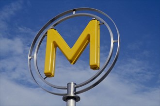 FRANCE, Ile de France, Paris, A yellow Metro sign agaisnt the sky