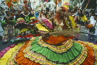 ENGLAND, London, Dancers in colourful costume at Notting Hill Carnival.