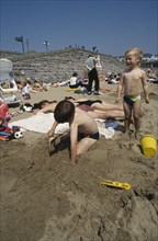 CHILDREN, Playing , Outdoor, "Kids on Barry Island beach, Wales"