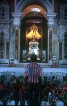 CUBA, Palma , Sorlano Church interior with worshiper standing at the altar