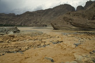 CHINA, Yellow River, Muddy waters flowing through rugged landscape