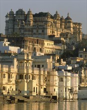 INDIA, Rajasthan, Udaipur, The City Palace in evening sunlight