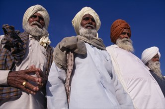 INDIA, Punjab, Amritsar , "Elderly Sikh men, three-quarter view seen from below looking up."