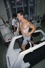 10038990 SPORT Athletics Health V02 maximum endurance testing  man being monitored on treadmill.