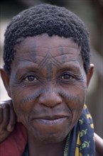 MOZAMBIQUE, Maputo, Portrait of woman with facial tattoos.