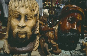 WEST INDIES, Jamaica, Ocho Rios, Wooden carved statues on market stall